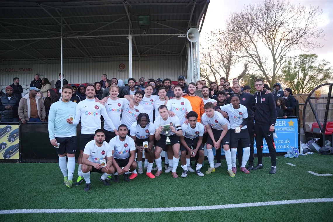 Camden United footballers and supporters together on the pitch